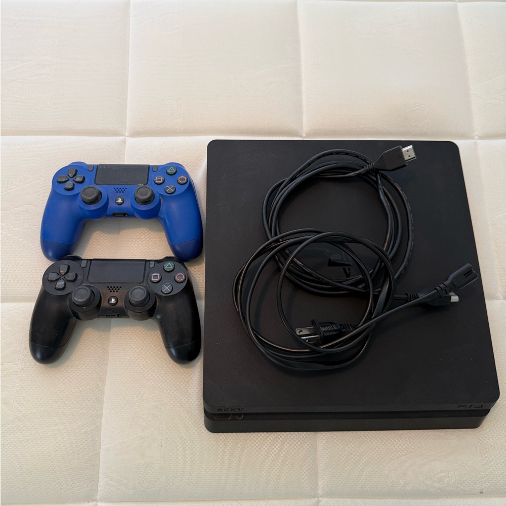 Sony PS4 Console with Blue and Black Controllers and 17 games
